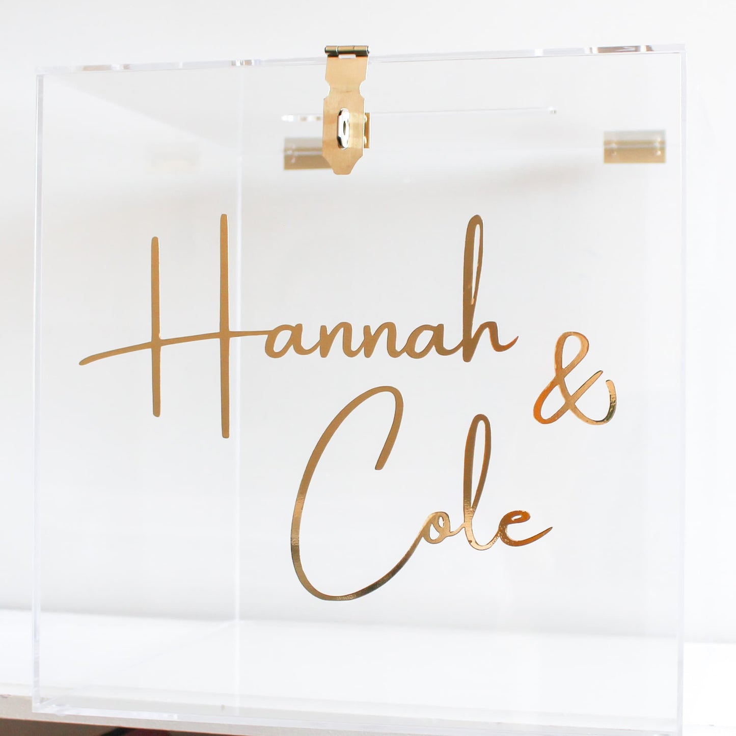 Clear acrylic wishing well box with gold text