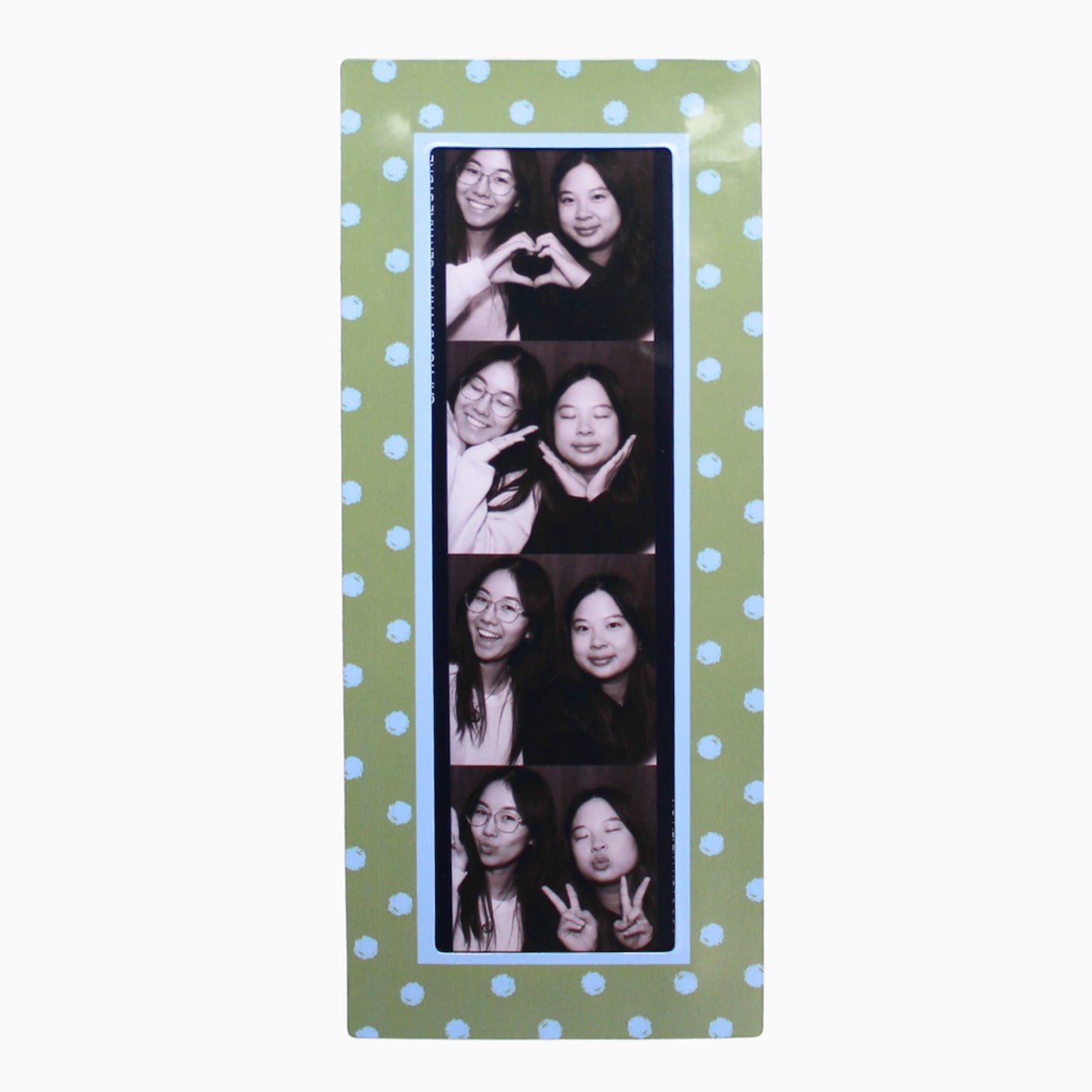 Collage of a woman making various poses on a green polka dot magnetic photo booth frame