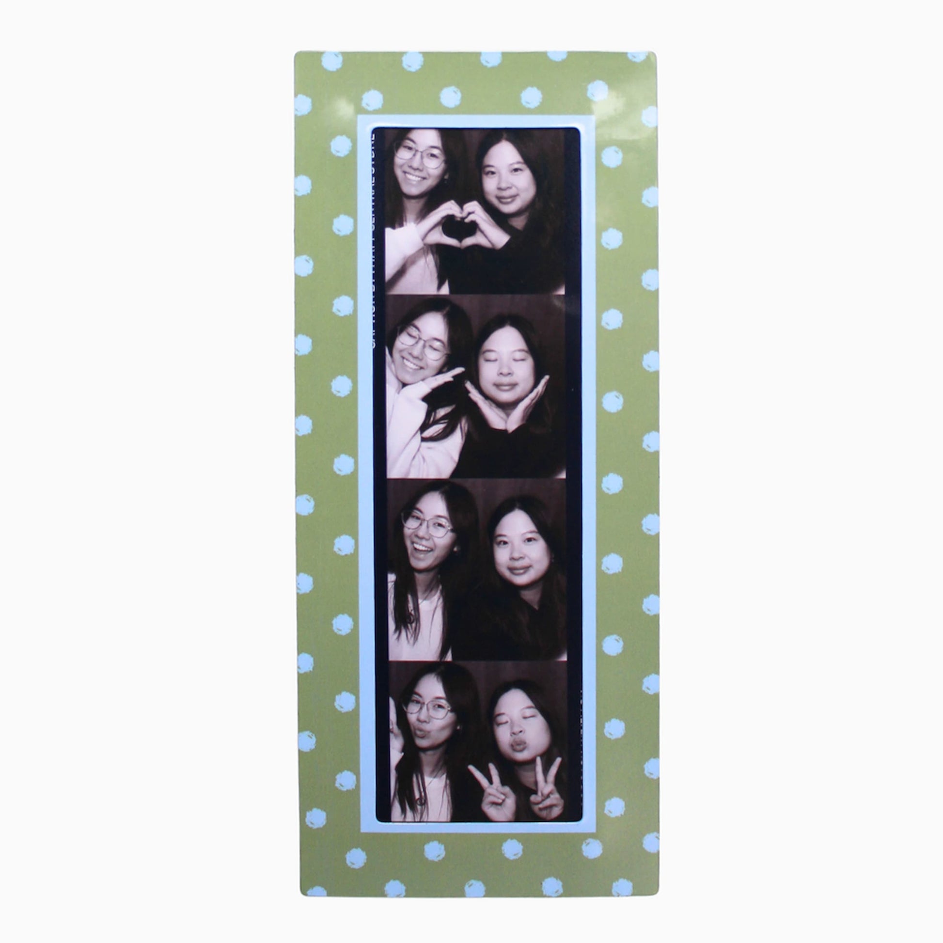 Collage of a woman making various poses on a green polka dot magnetic photo booth frame