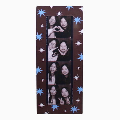 Collage magnetic photo frame with star patterns on a brown background