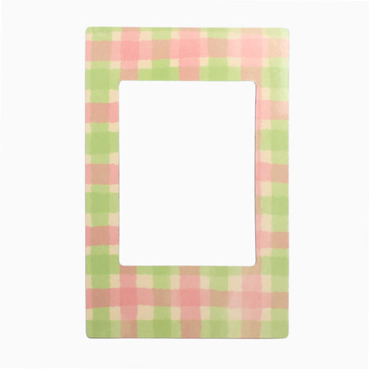 Rectangular magnetic polaroid frame with pink and green checkered pattern on a white background