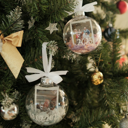 Decorative Polaroid Bauble Christmas ornaments with family photos and dates on a Christmas tree.