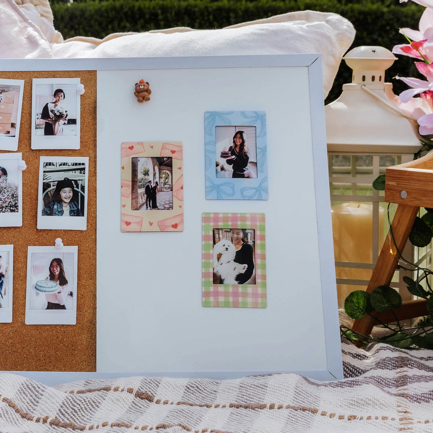magnetic photo frame collage with a mix of printed and framed photos on a decorative surface.