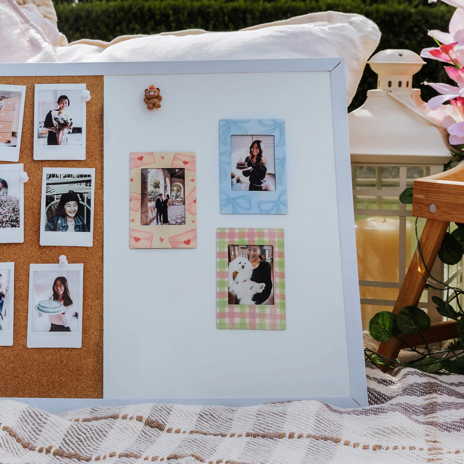 magnetic photo frame collage with a mix of printed and framed photos on a decorative surface.