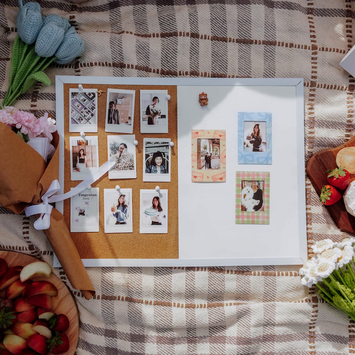  cork board with photos on a checkered tablecloth