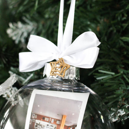 Clear glass polaroid bauble with white ribbon a gold star charm