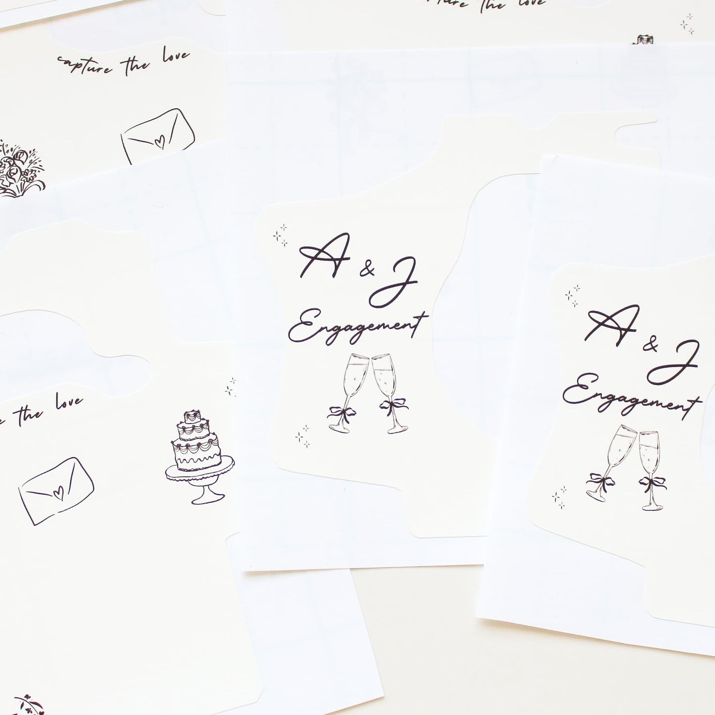 kodak disposable camera wraps with 'A & J Engagement' text and wedding-themed illustrations on a white background.