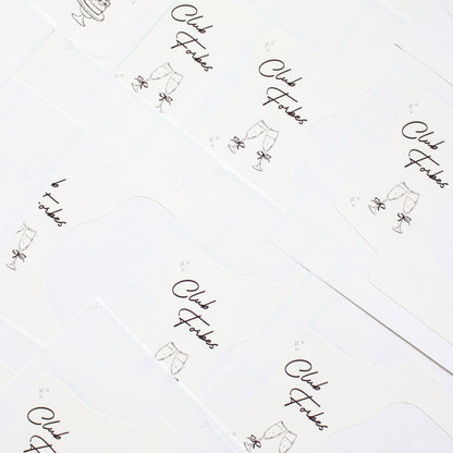 Repeating pattern of 'Club Forbes' logo kodak disposable camera wraps
