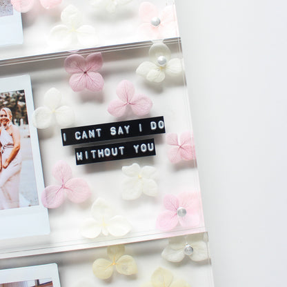 personalised flower frame with 'I can't say I do without you' message, surrounded by pink and white flowers.