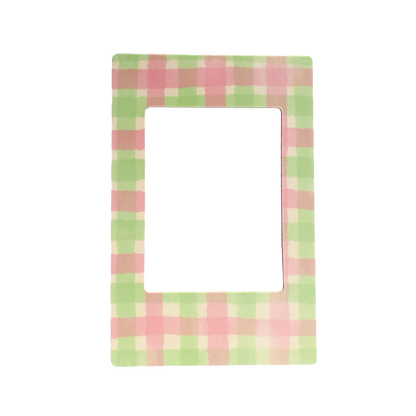 Magnetic photo frame with pink and green checkered pattern on a white background