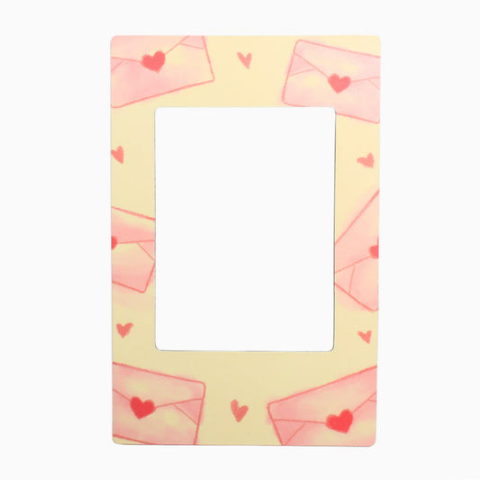 Decorative frame with pink envelopes and red hearts on a yellow background